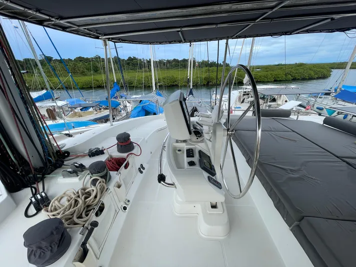 Matilda Mia Yacht Photos Pics Helm of 2015 Lagoon 52 catamaran with steering wheel and navigation equipment.