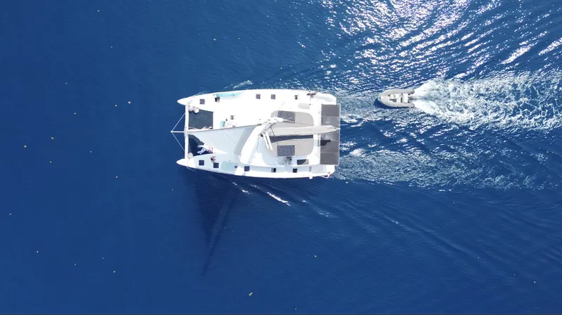 Matilda Mia Yacht Photos Pics Aerial view of 2015 Lagoon 52 catamaran sailing in deep blue ocean.