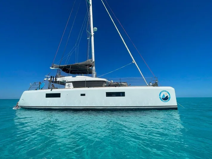 Matilda Mia Yacht Photos Pics 2015 Lagoon 52 catamaran sailing on clear blue waters under a bright sky.