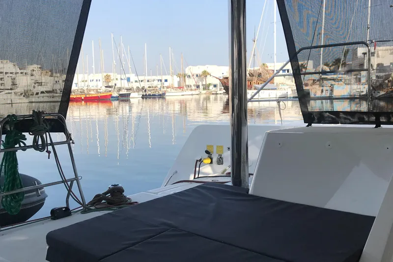 Matilda Mia Yacht Photos Pics Lagoon 52 catamaran, 2015 model, docked in a serene marina with sailboats.