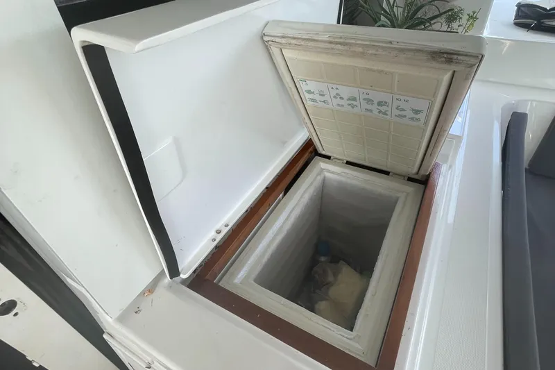 Matilda Mia Yacht Photos Pics Open storage compartment on 2015 Lagoon 52 yacht, showcasing interior space.