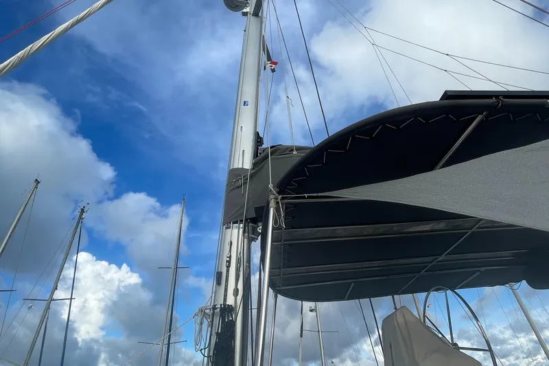 Matilda Mia Yacht Photos Pics Sailing yacht Lagoon 52, 2015 model, mast and sails against a cloudy blue sky.