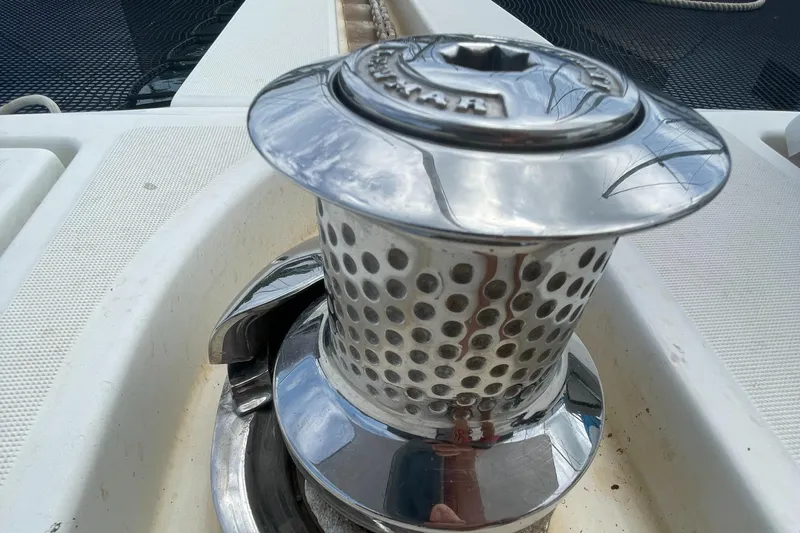 Matilda Mia Yacht Photos Pics Chrome winch on 2015 Lagoon 52 yacht deck, reflecting sky and surroundings.