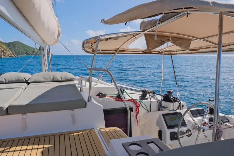 Ruckus Yacht Photos Pics 2021 Fountaine Pajot Elba 45 Catamaran sailing on clear blue waters.