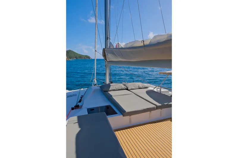 Ruckus Yacht Photos Pics 2021 Fountaine Pajot Elba 45 Catamaran on open sea, featuring spacious deck and comfortable seating.