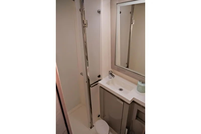 Ruckus Yacht Photos Pics Bathroom interior of 2021 Fountaine Pajot Elba 45 Catamaran with modern fixtures.