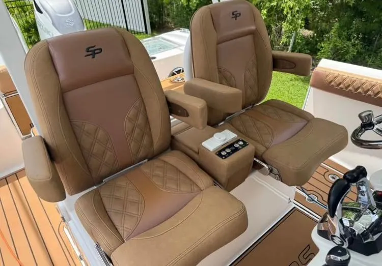  Yacht Photos Pics Luxurious seating on 2022 Sea Pro 320 DLX Offshore boat, featuring brown leather upholstery.