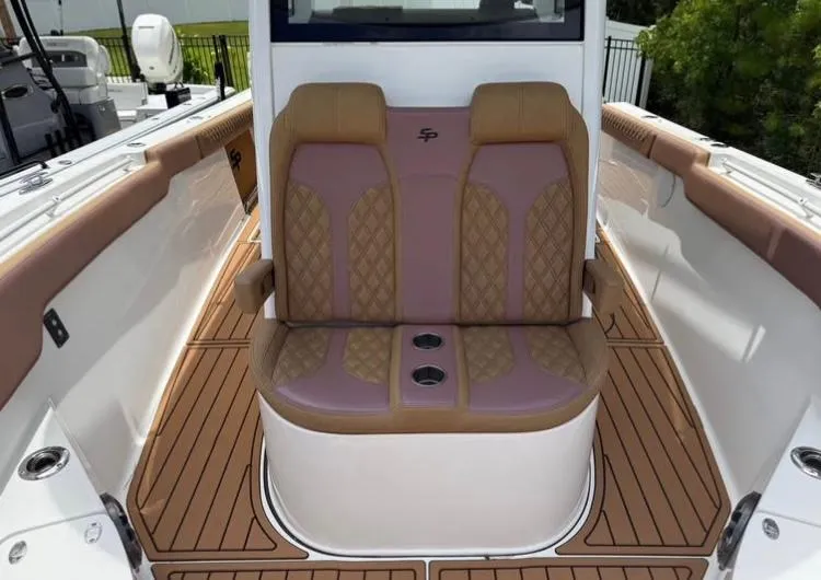  Yacht Photos Pics 2022 Sea Pro 320 DLX Offshore boat seating with tan and purple upholstery.