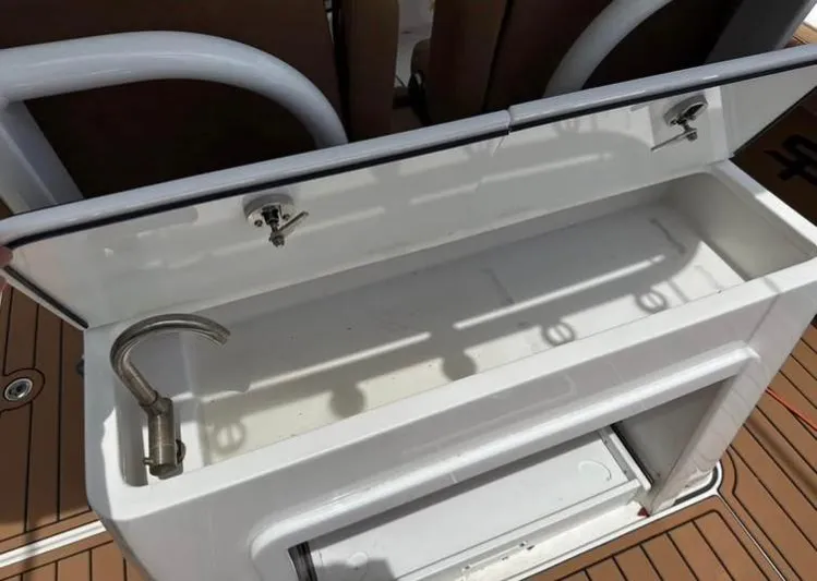  Yacht Photos Pics 2022 Sea Pro 320 DLX Offshore boat sink and storage area.