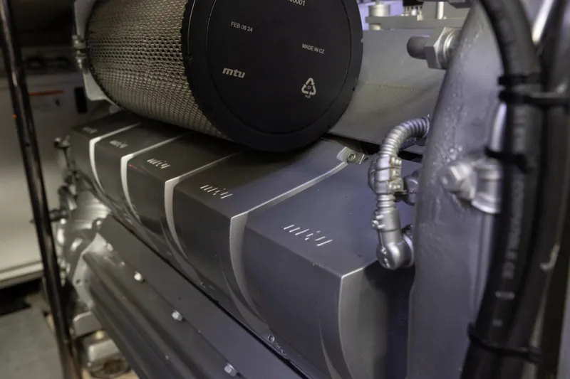 Plastered Yacht Photos Pics Engine compartment of 2016 Pershing 62 yacht, featuring MTU components.