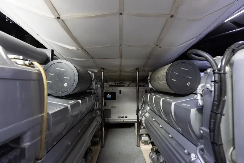 Plastered Yacht Photos Pics Engine room of 2016 Pershing 62 yacht with Kohler generator and dual engines.
