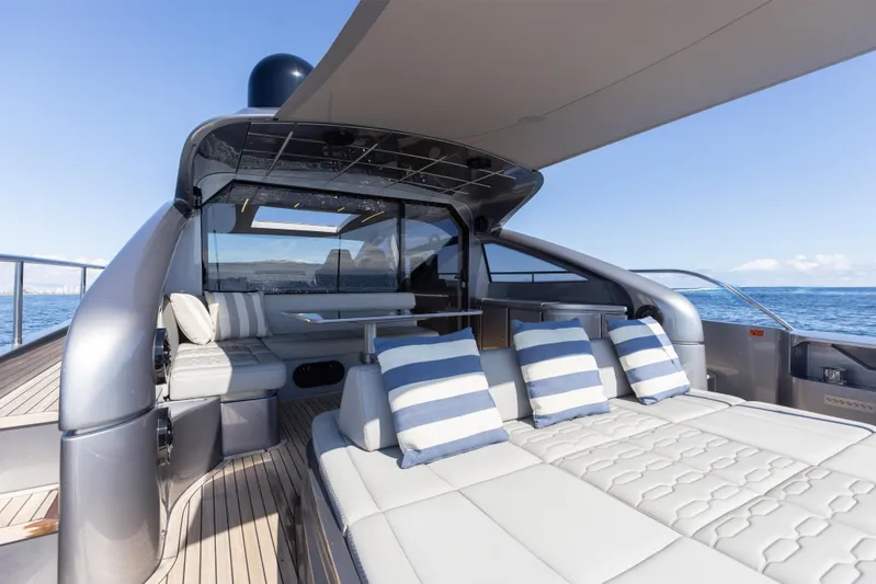 Plastered Yacht Photos Pics Luxurious 2016 Pershing 62 yacht deck with striped cushions and ocean view.