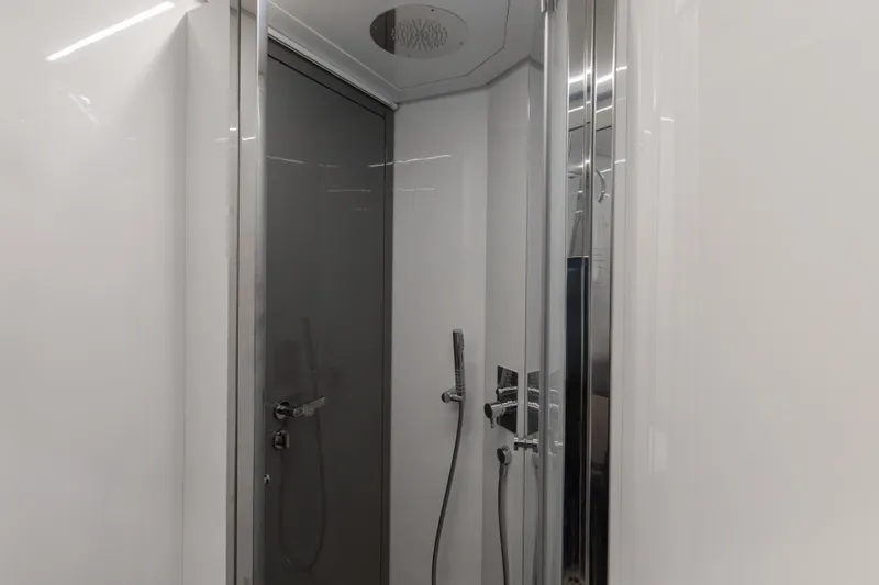 Plastered Yacht Photos Pics Modern shower in 2016 Pershing 62 yacht, featuring sleek design and chrome fixtures.