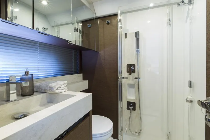  Yacht Photos Pics Manufacturer Provided Image: Modern bathroom in 2022 Prestige 520 S yacht with sleek fixtures and glass shower.