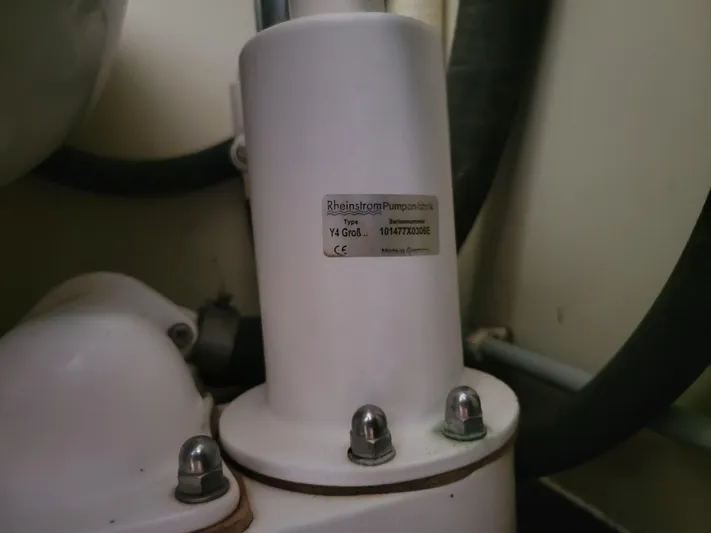 Maisie Rose Yacht Photos Pics Close-up of a 1984 Kuipper NV Holland mechanical component with label and bolts.