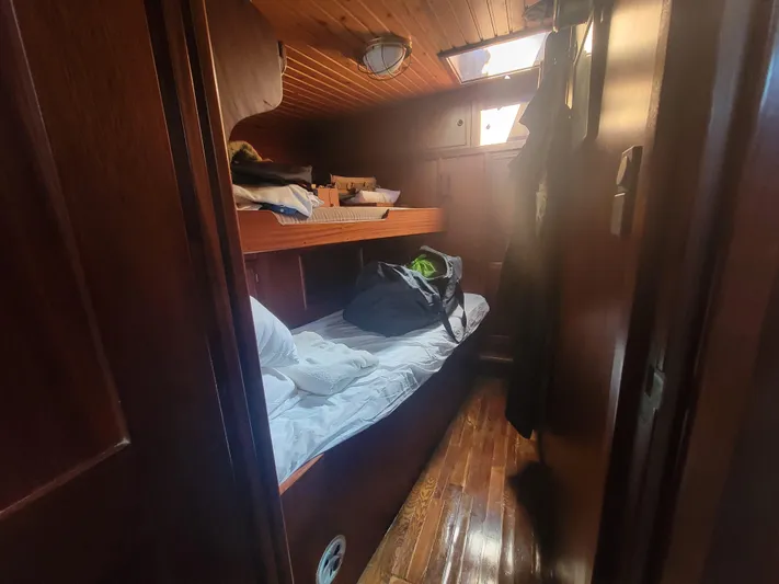 Maisie Rose Yacht Photos Pics Cozy wooden cabin interior with bunk beds on a 1984 Kuipper NV Holland boat.