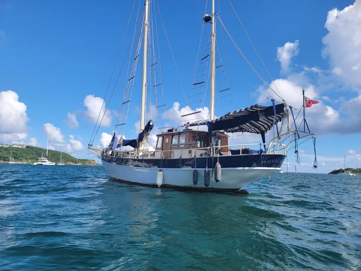 Maisie Rose Yacht Photos Pics Sailing yacht "Kuipper NV Holland" 1984 on blue ocean under clear sky.
