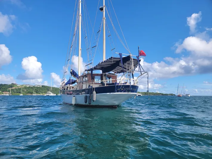 Maisie Rose Yacht Photos Pics Vintage 1984 Kuipper NV Holland sailboat on blue ocean under clear sky.
