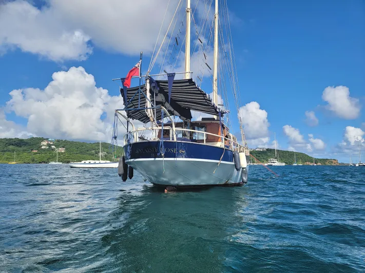 Maisie Rose Yacht Photos Pics Sailing yacht "Kuipper NV Holland" 1984 on blue ocean with scenic sky.