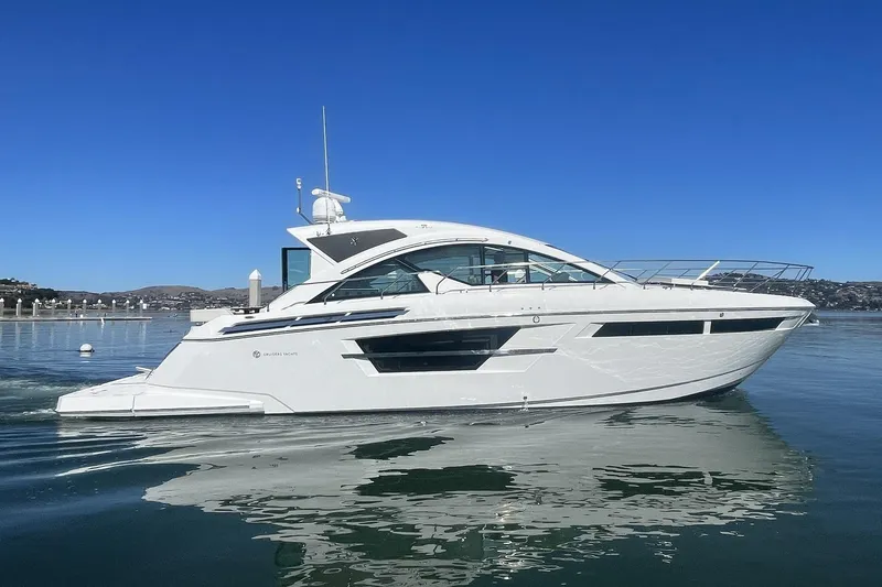 Simply Complicated Yacht Photos Pics 2019 Cruisers Yachts 54 Cantius on calm water under clear blue sky.