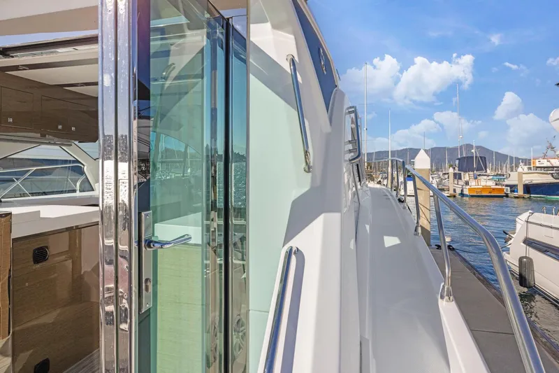 Simply Complicated Yacht Photos Pics 2019 Cruisers Yachts 54 Cantius docked, showcasing sleek design and luxurious interior.