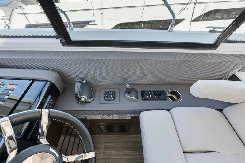 Simply Complicated Yacht Photos Pics 2019 Cruisers Yachts 54 Cantius helm with modern controls and comfortable seating.