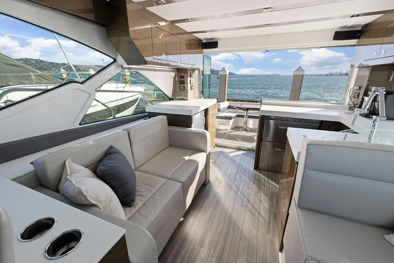 Simply Complicated Yacht Photos Pics Luxurious interior of 2019 Cruisers Yachts 54 Cantius with scenic ocean view.