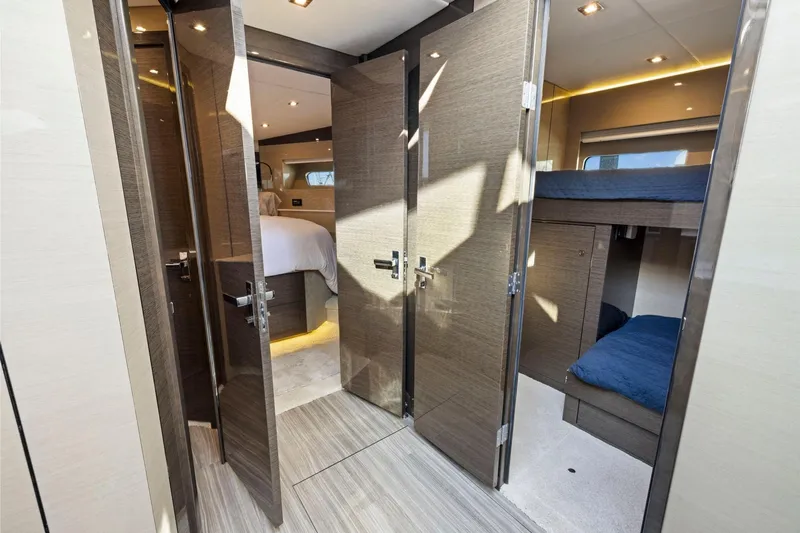 Simply Complicated Yacht Photos Pics Luxurious interior of 2019 Cruisers Yachts 54 Cantius with modern bedroom and bunk beds.