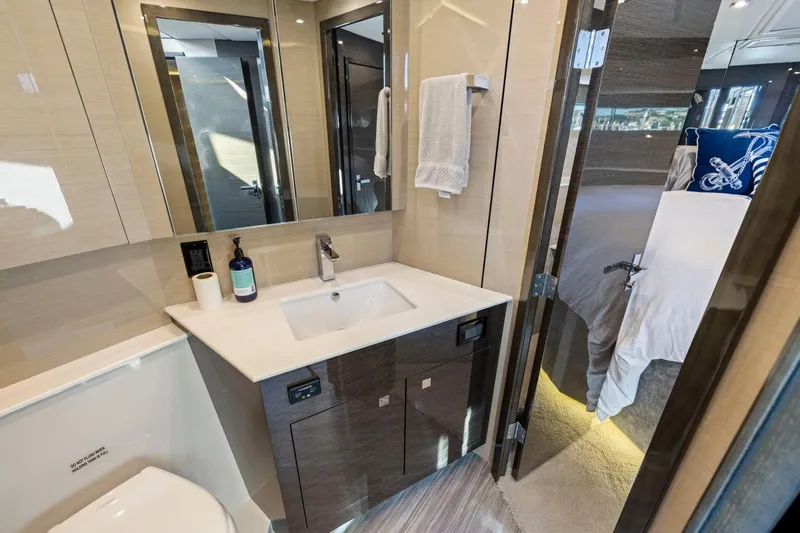 Simply Complicated Yacht Photos Pics Luxurious bathroom in 2019 Cruisers Yachts 54 Cantius, featuring modern sink and elegant decor.