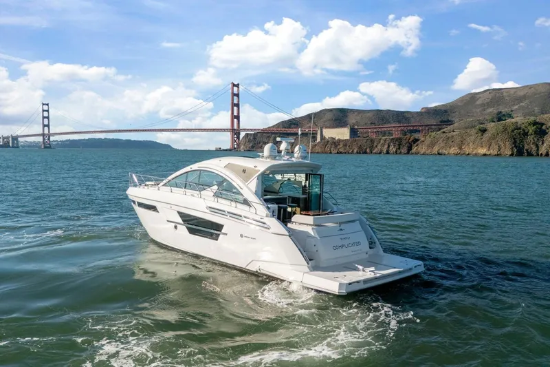 Simply Complicated Yacht Photos Pics 2019 Cruisers Yachts 54 Cantius sailing near Golden Gate Bridge, sunny day.