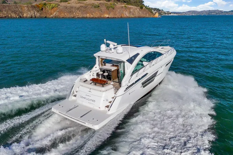 Simply Complicated Yacht Photos Pics 2019 Cruisers Yachts 54 Cantius cruising on blue ocean waters.