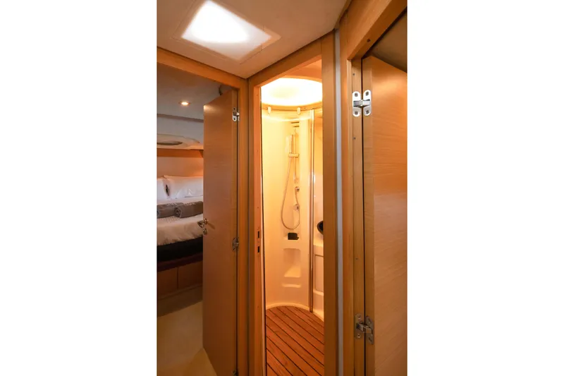 Shine IV Yacht Photos Pics Interior of 2006 Azimut 43 yacht showing shower and cozy bedroom.