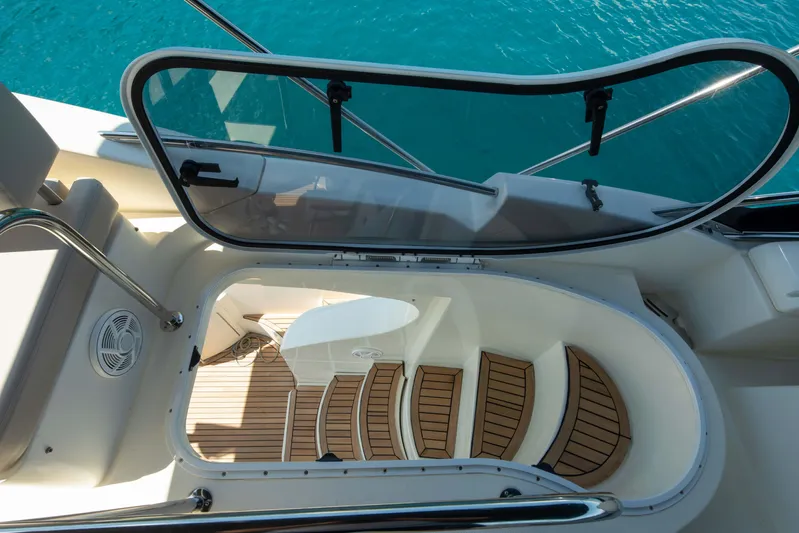 Shine IV Yacht Photos Pics Staircase on 2006 Azimut 43 yacht leading to lower deck, with clear blue water view.