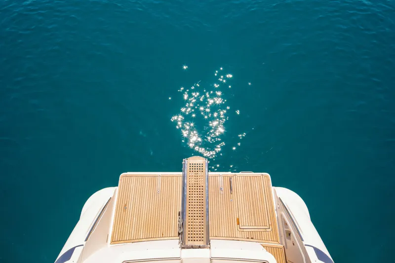 Shine IV Yacht Photos Pics Azimut 43 yacht deck, 2006 model, overlooking sparkling blue water.