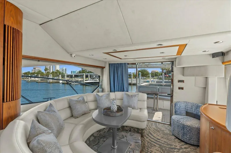 Cheers Yacht Photos Pics Luxurious interior of 2009 Sunseeker Manhattan 52 yacht with waterfront view.