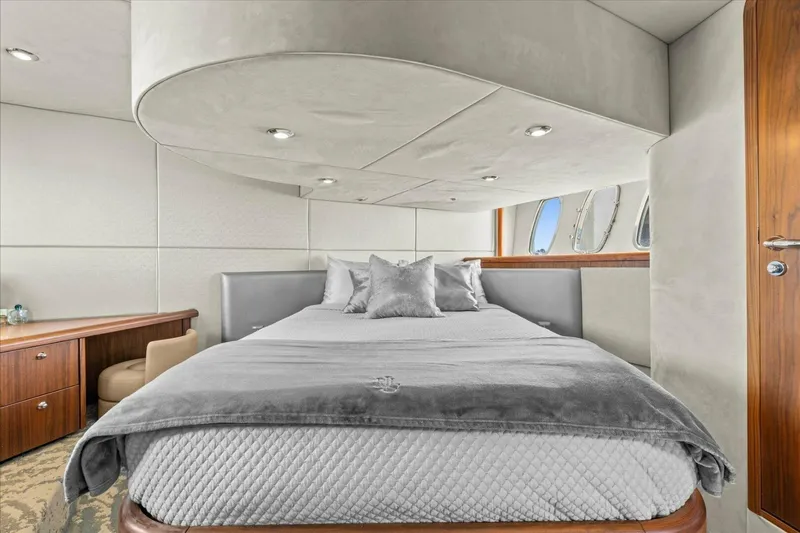 Cheers Yacht Photos Pics Luxurious bedroom interior of 2009 Sunseeker Manhattan 52 yacht with elegant furnishings.