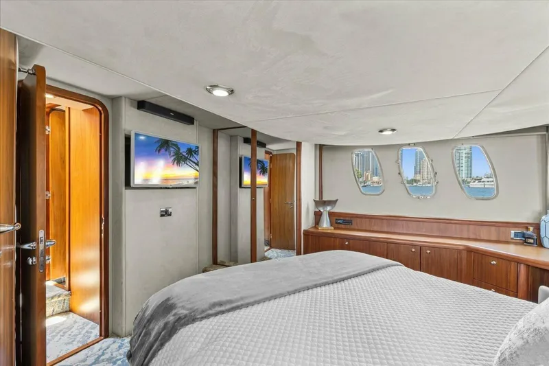 Cheers Yacht Photos Pics Luxurious cabin interior of 2009 Sunseeker Manhattan 52 yacht with scenic windows.