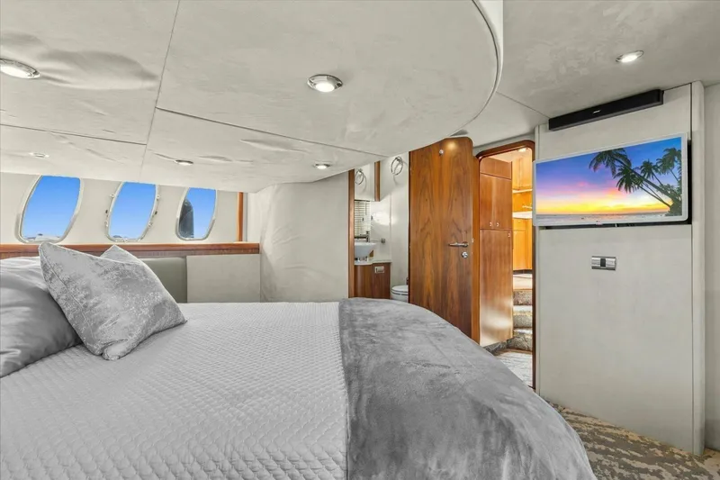 Cheers Yacht Photos Pics Luxurious interior of 2009 Sunseeker Manhattan 52 yacht with elegant bedroom and scenic window views.