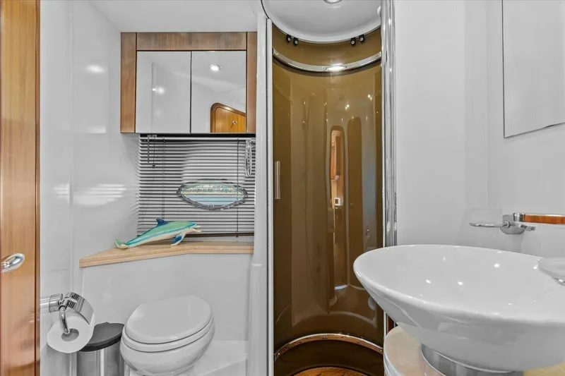 Cheers Yacht Photos Pics Luxurious bathroom in 2009 Sunseeker Manhattan 52 yacht with modern fixtures and elegant design.