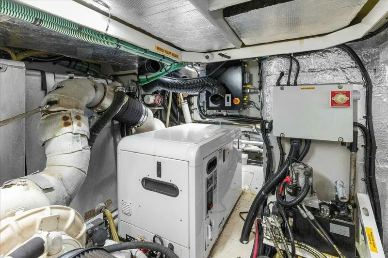 Cheers Yacht Photos Pics Engine room of 2009 Sunseeker Manhattan 52 yacht, featuring mechanical and electrical systems.