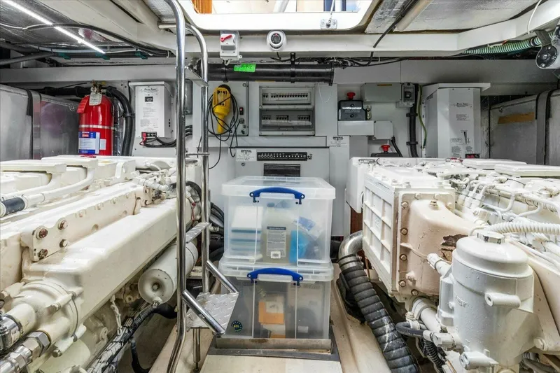 Cheers Yacht Photos Pics Engine room of 2009 Sunseeker Manhattan 52 yacht with equipment and storage containers.