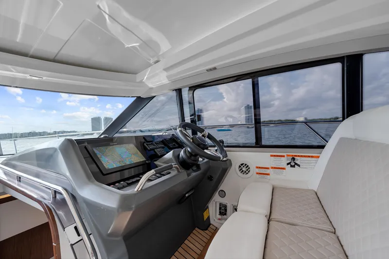 Notre Reve Yacht Photos Pics Interior view of 2018 Jeanneau Leader 46 yacht cockpit with navigation system.