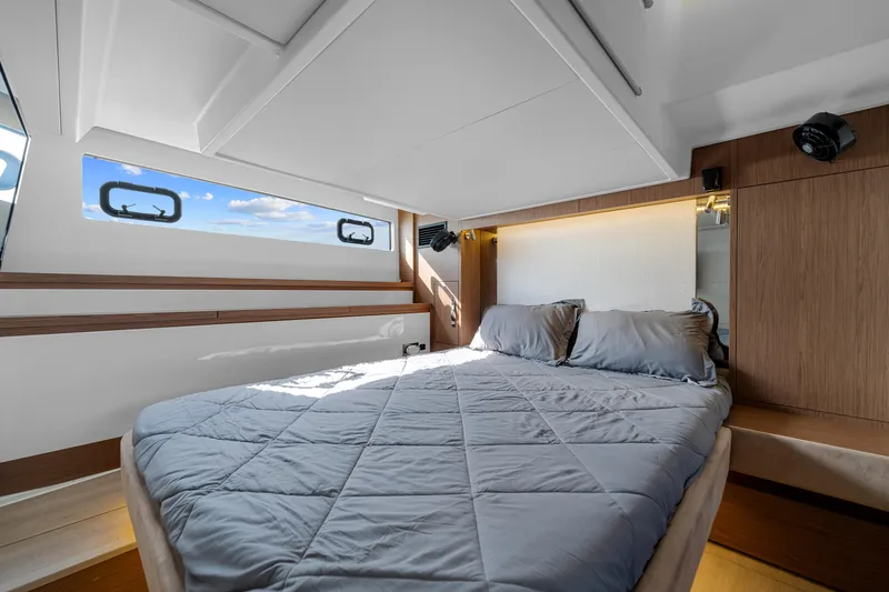 Notre Reve Yacht Photos Pics Luxurious cabin interior of 2018 Jeanneau Leader 46 yacht with cozy bedding.