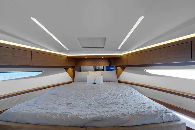 Notre Reve Yacht Photos Pics Luxurious interior of 2018 Jeanneau Leader 46 yacht with spacious bed and modern design.