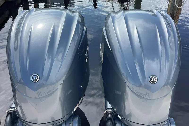  Yacht Photos Pics Twin Yamaha outboard engines on a 2022 Grady-White Canyon 271 boat, docked on water.