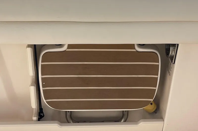  Yacht Photos Pics 2022 Grady-White Canyon 271 boat detail, featuring a wooden step with white trim.