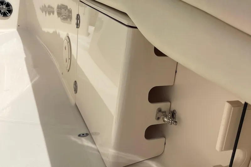  Yacht Photos Pics 2022 Grady-White Canyon 271 boat interior, featuring storage compartments and sleek design elements.