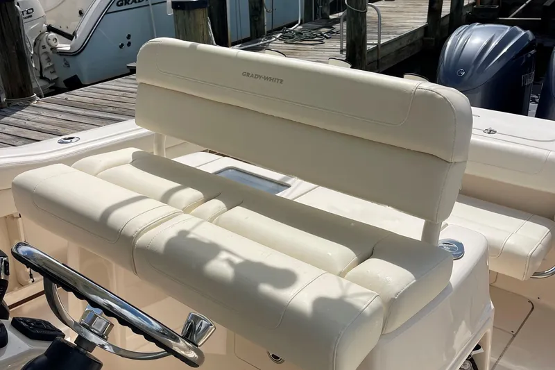  Yacht Photos Pics 2022 Grady-White Canyon 271 boat with cream leather seating and steering wheel.