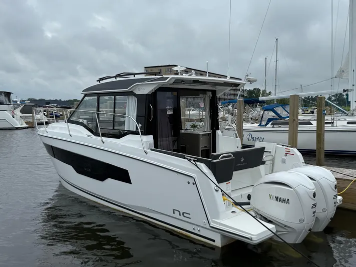  Yacht Photos Pics 2024 Jeanneau NC Weekender 895 Series 2 boat docked with twin Yamaha engines.