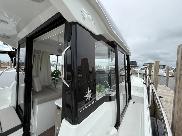  Yacht Photos Pics 2024 Jeanneau NC Weekender 895 Series 2 docked, showcasing sleek design and spacious interior.